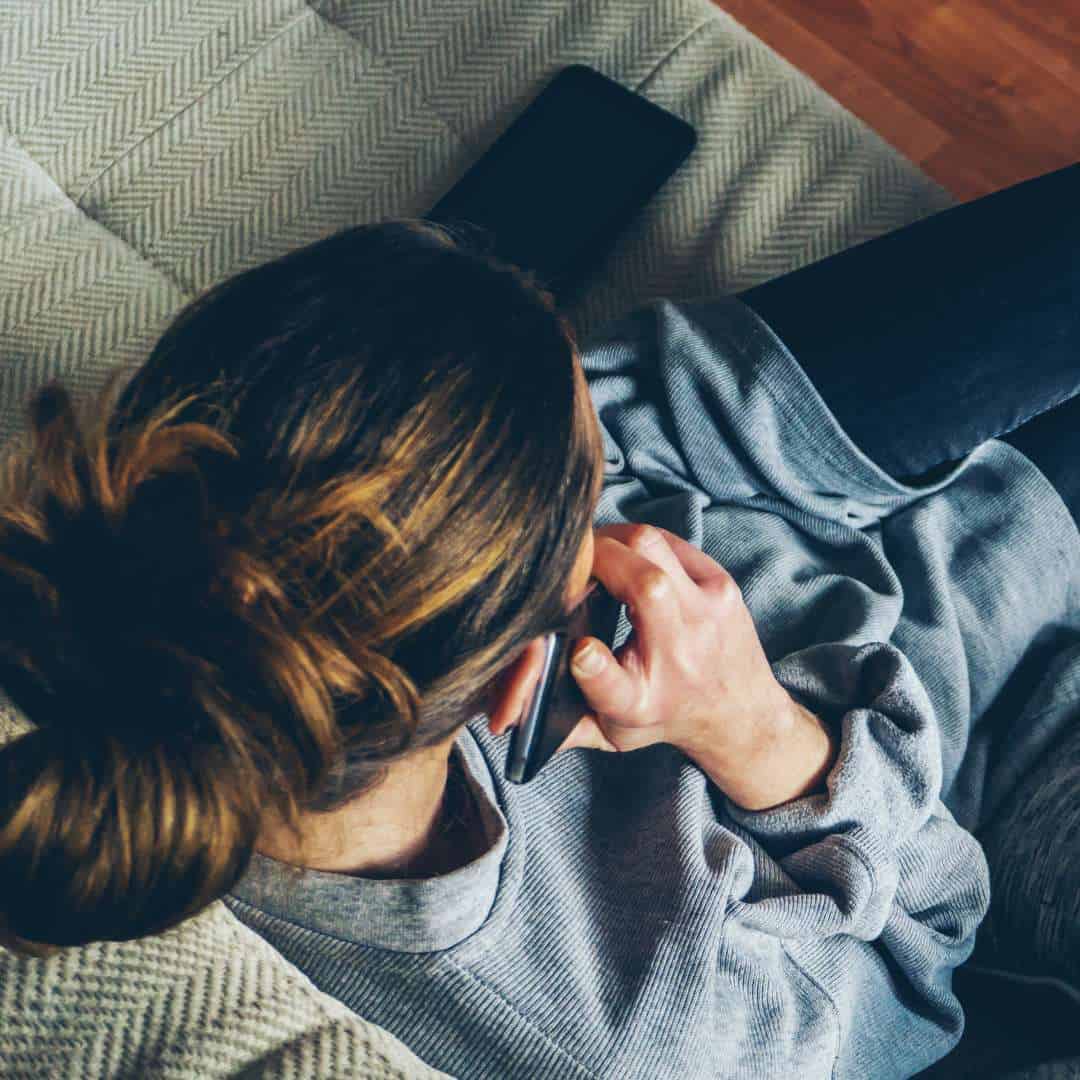  Woman calling in to the free drug and alcohol addiction hotline number to start her rehab treatment