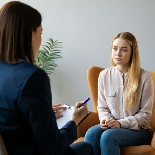   Psychologist Working With Patient In Her Office Doing Motivational Interviewing